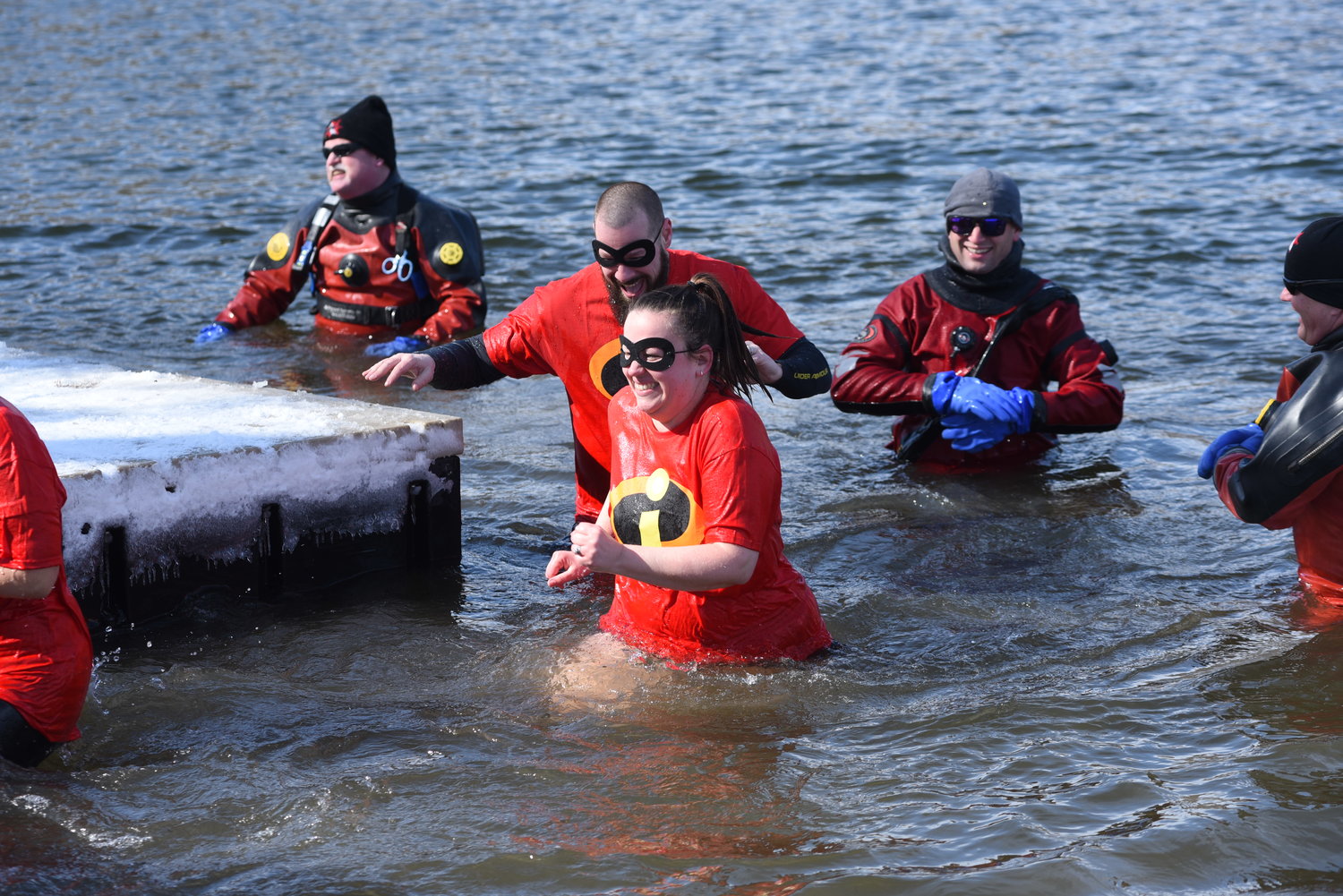 Braving a frigid morning with temperatures in the teens, 16 teams jumped into the lake.
